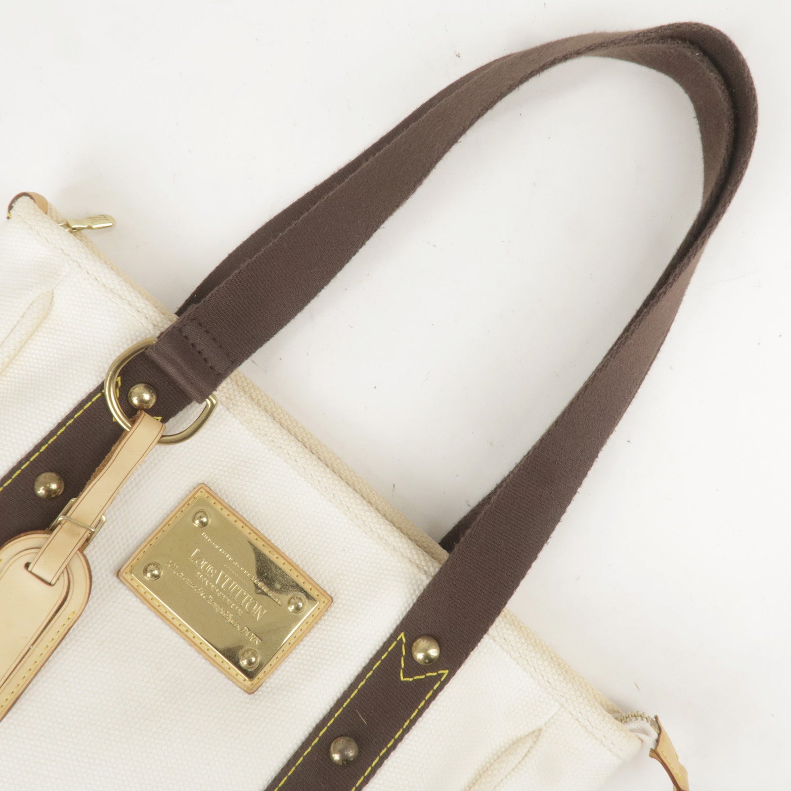 Canvas and gold leather hand-bag with belt and buckle Louis Vuitton  Inventeur