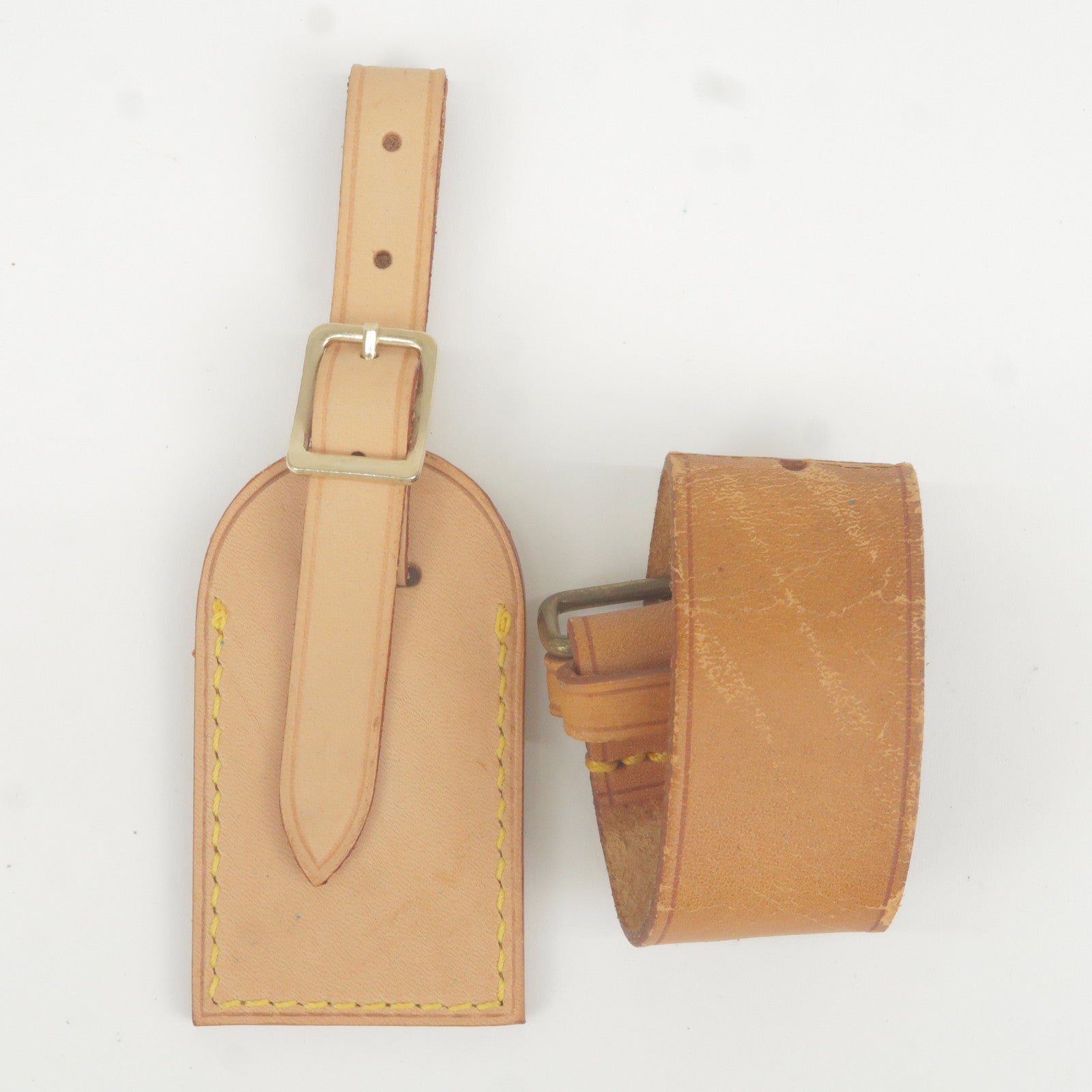 Authentic Louis Vuitton LV Name Tag and Poignet set Pre-owned.