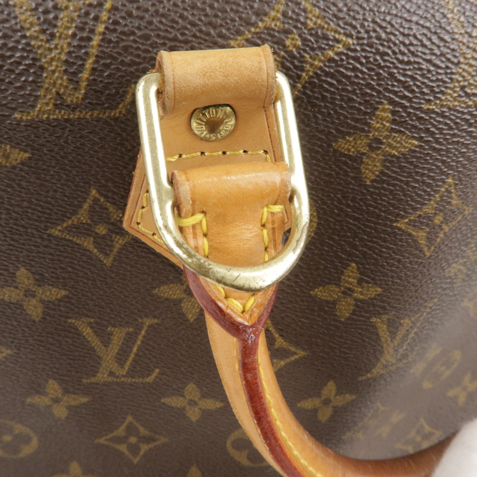 This suitcase from the luxury brand Louis Vuitton is in monogrammed canvas