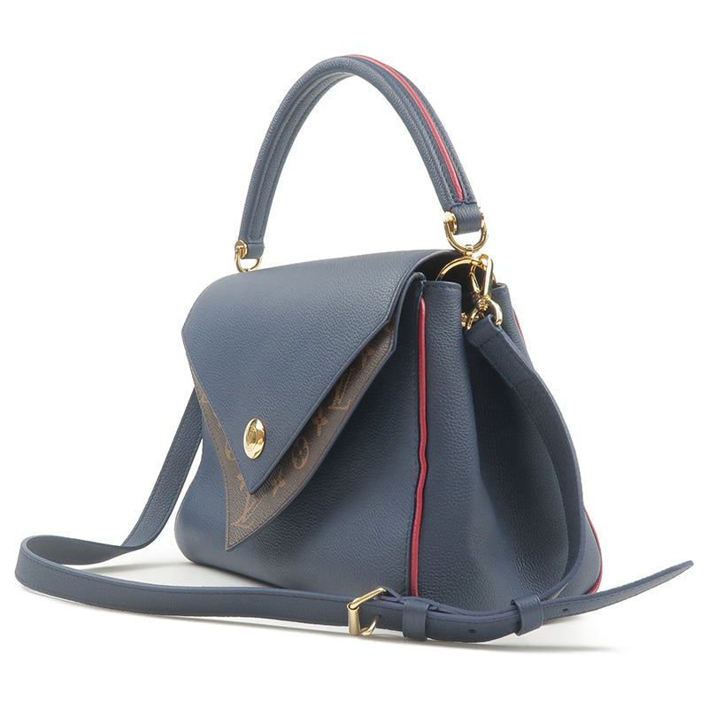 Louis Vuitton on X: City chic. The versatile Double V bag is