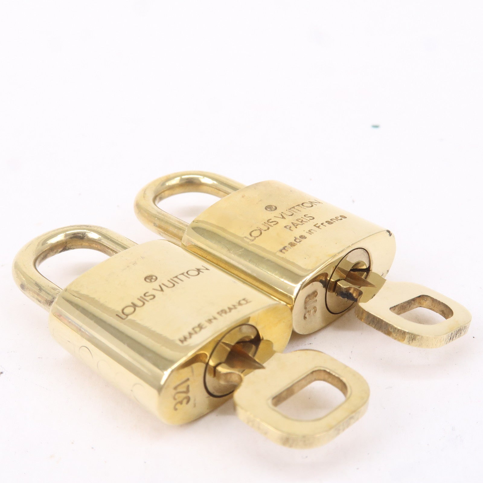 AUTHENTIC Near Mint Louis Vuitton lock and key.