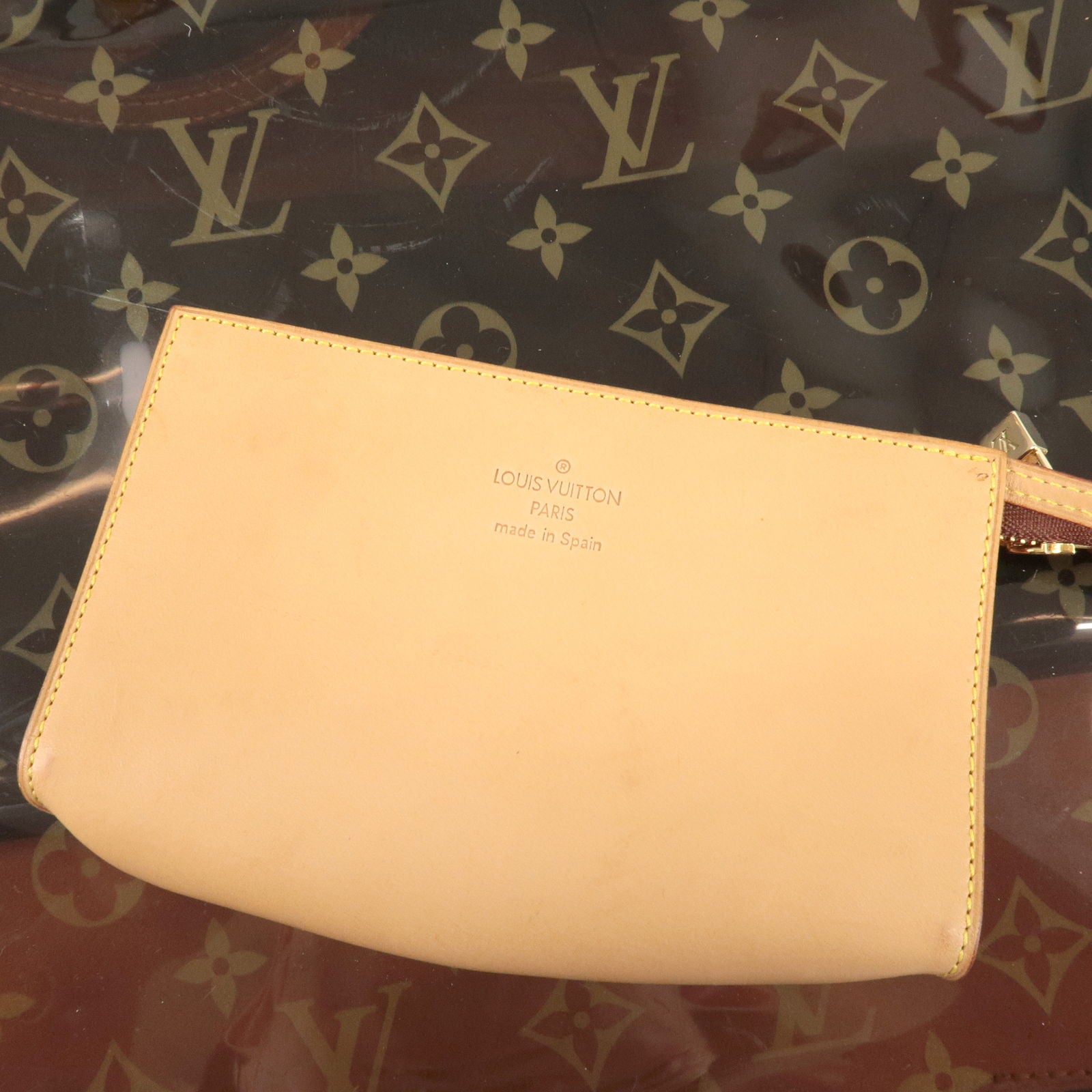 Pochette accessoire vinyl handbag Louis Vuitton Brown in Vinyl