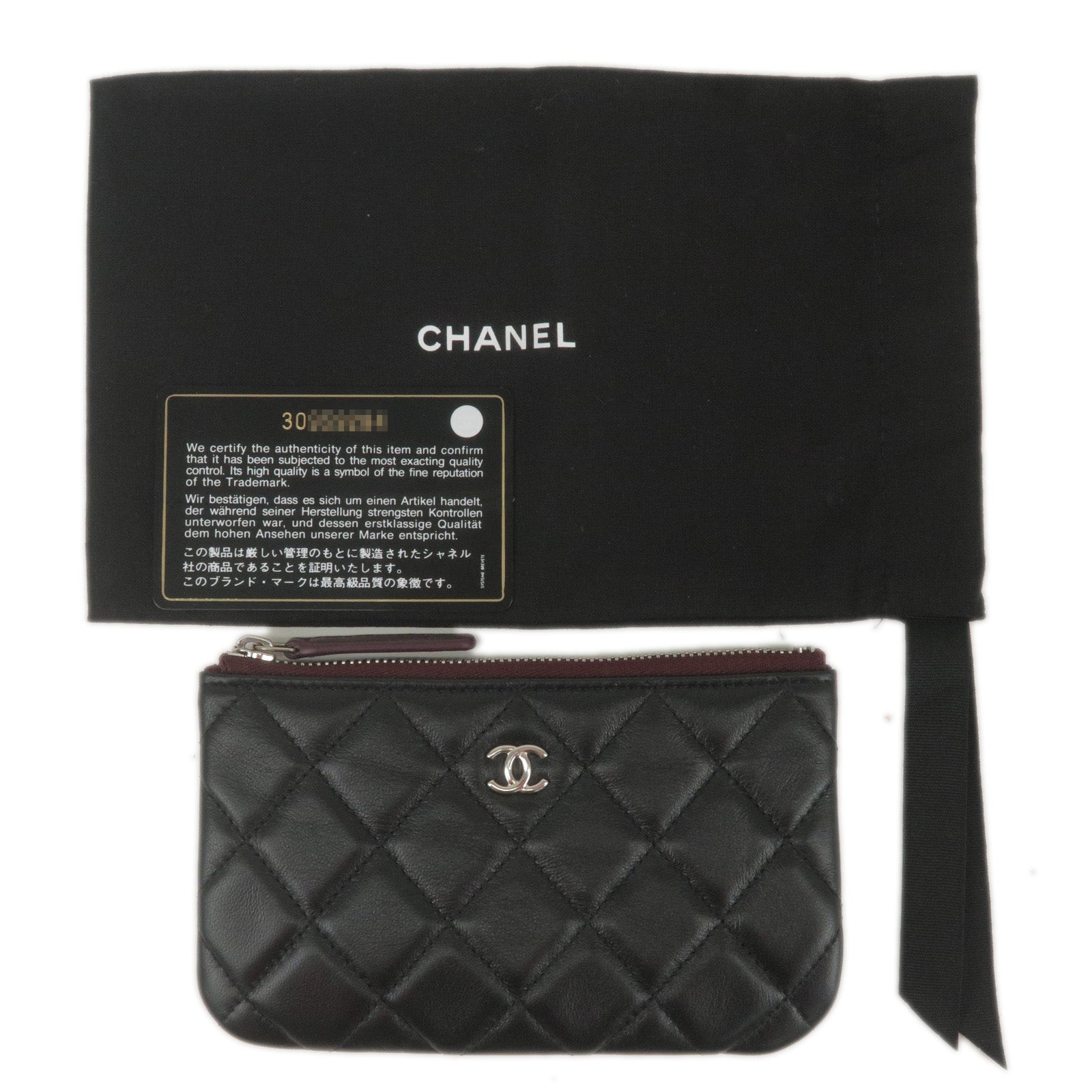 Chanel Small Classic Zipped Cosmetic Pouch in Black Lambskin with Silver  Hardware - SOLD